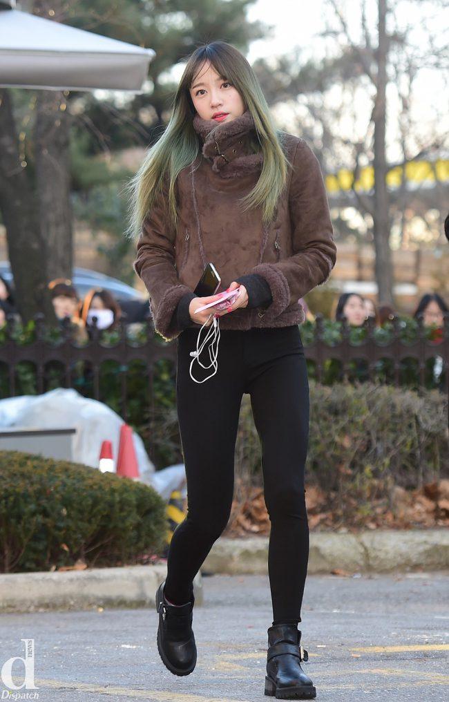 EXID's Hani shows off her "biker fashion" in black jeans, mustang jacket and thick boots. Her green hair also adds a spunky kick to her look.