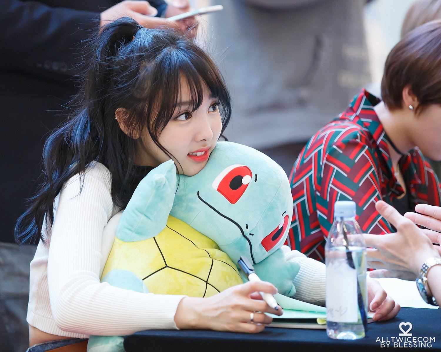 Nayeon with a pokemon toy.