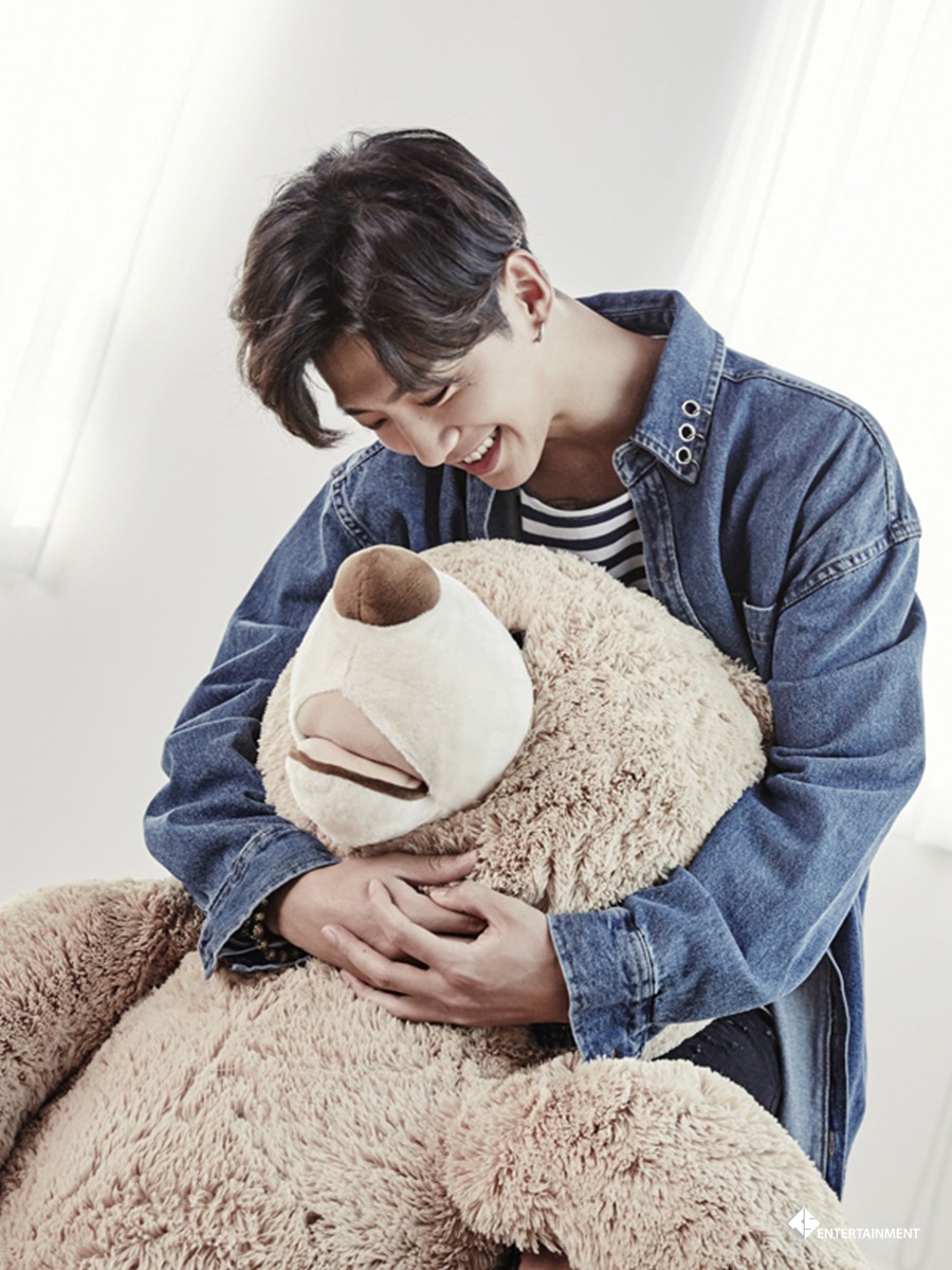 Yongguk holding a bear.