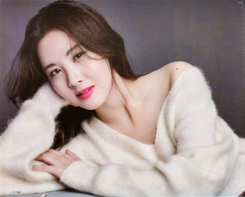 Seohyun poses for Star 1 Magazine in a low cut furry sweater. 