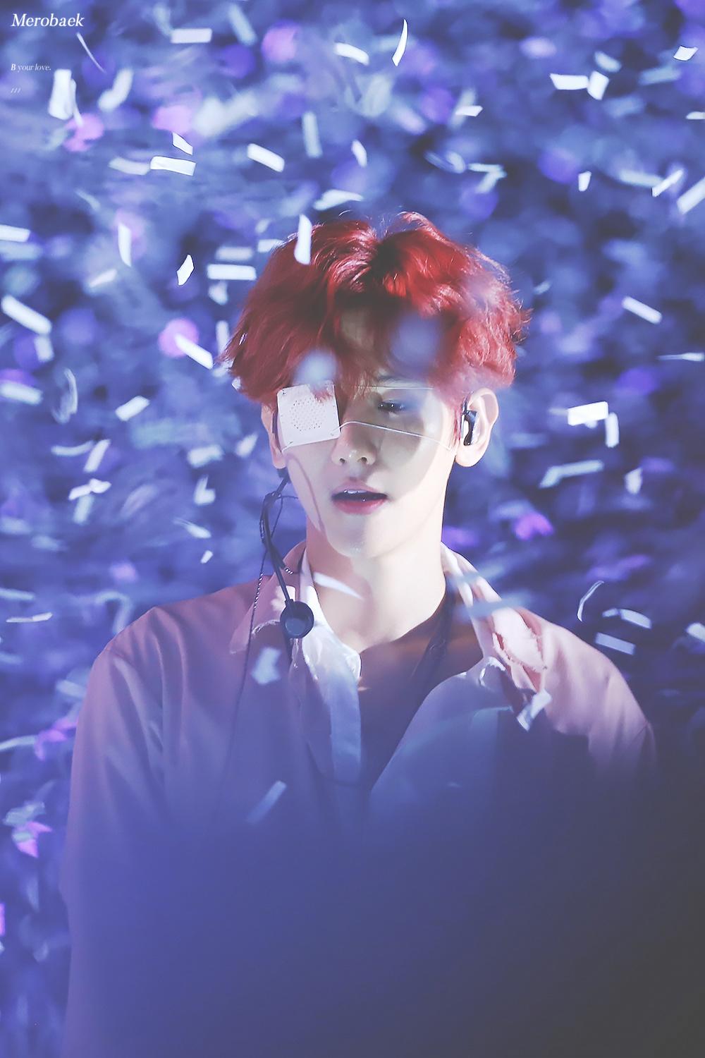 Baekhyun looked down as confetti falls after EXO finished their powerful performances. 