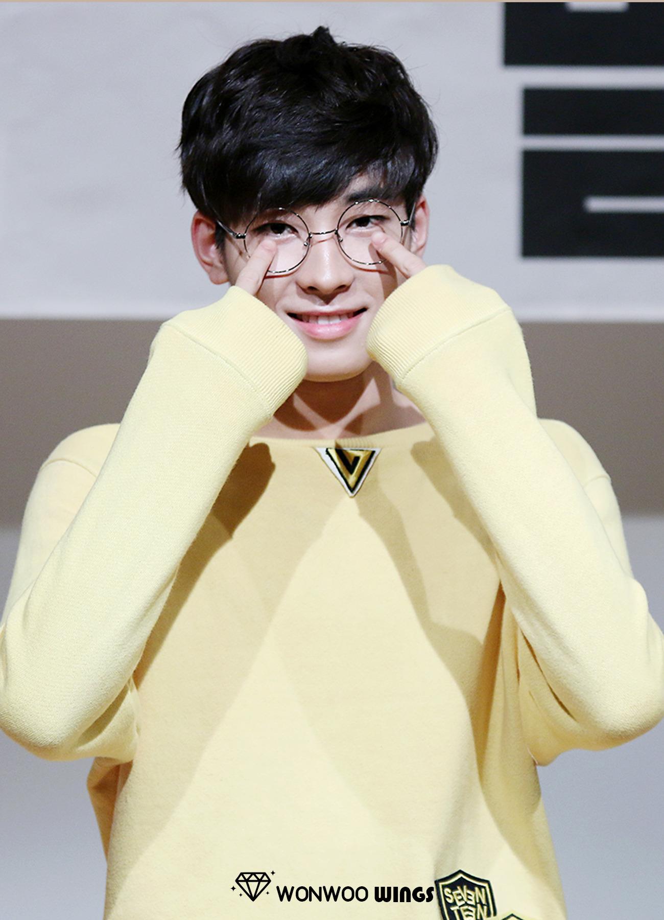 Wonwoo proves that his glasses are really for his bad vision by touching them. 